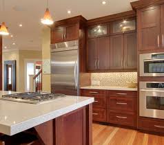 Cherry Wood Cabinets With Stainless And Light Countertop Cherry Wood Kitchen Cabinets Cherry Wood Kitchens Quartz Kitchen Countertops