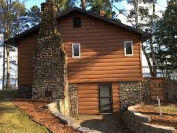 The metal paneling is 100% recyclable, leaving a smaller carbon footprint and making your home more efficient. Custom Log Cabin In Northern Minnesota Rustic Exterior Minneapolis By Trulog Steel Log Siding Houzz