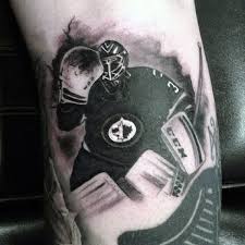 What makes a good tattoo for a hockey player? 75 Hockey Tattoos For Men Nhl Design Ideas
