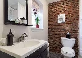 Unfinished bathroom cabinets are ideal for the homeowner who likes to do it herself. Marble And Exposed Brick Novocom Top