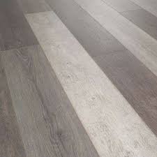 Water Resistant Zermatt Oak 12mm Thick Laminate Flooring 14 33 Sq Ft Laminate Flooring Flooring Oak Laminate Flooring