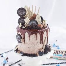 Six layer chocolate cake with toasted marshmallow filling and malted chocolate frosting. The Ultimate Oreo Cake A Bajillian Recipes