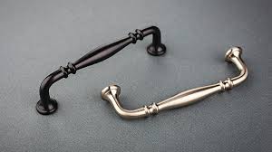 The pulls have threaded posts on the back side, and the screws slide through holes in the cabinet face into the posts. Bathroom Hardware Basics Destination Lighting Flip The Switch