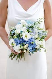 Country Style Bouquet Consiting Of Blue Delphinium And Hydrangea And White Lisianthus Weddingf Blue Wedding Flowers Blue Wedding Bouquet Wedding Flower Guide