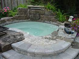 Outdoor floor tile is very similar to indoor floor tile, except that it can withstand weather conditions and tolerate more wear. Awesome Outdoor Hot Tub Designed With Stoned Desk Floor Tile Also Decorative White Lantern Idea Hot Tub Landscaping Inground Hot Tub Hot Tub Outdoor
