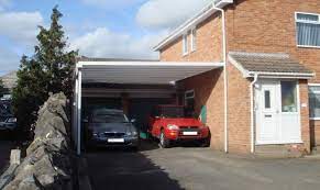 A carport is a covered structure used to offer limited protection to vehicles, primarily cars, from rain and snow. Carport Vs Garage A Quick Guide To Help You Decide