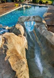 Spectacular How To Build A Waterfall Into A Pool Ideas In Pool Tropical Design Ideas With Constructed Landscape Swimming Pool Designs Backyard Pool Cool Pools