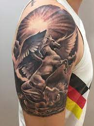 Pegasus Black And Grey Tattoo On Upper Arm By Krisztian At Tattoo Anansi Munich Germany Horse Tattoo On Arm Pegasus Tattoo Grey Tattoo Horse Tattoo