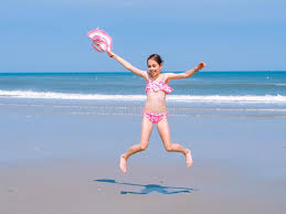 Young Happy Teen Girl Having Fun on Tropical Beach and Jumping in Pink  Swimsuit and Striped Hat into the Air on the Sea Coast Stock Photo - Image  of coast, leisure: 150034128