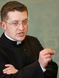 Young priest embraces more traditional roles