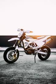 Hd Wallpaper Dope White And Black Dirt Bike Parked On Gray Concrete Pavement Wallpaper Flare