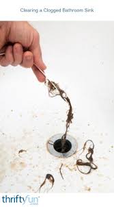 clearing a clogged bathroom sink