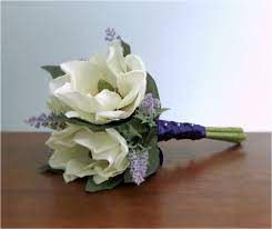 Ivory Magnolia Bridal Bouquet Accented With Lavender Magnolia Leaves And Wrappe Purple Wedding Bouquets Magnolias Wedding Bouquet Silk Flower Wedding Bouquet