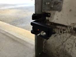 How to fix a garage door's photo eye. How To Realign Your Garage Door Sensors Overhead Door Depot