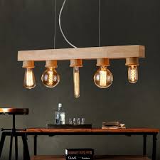Creez Une Ambiance Retro Grace A L Ampoule Led Filament The Blog Deco Salle A Manger Bois Luminaire Bois Lampe Bois