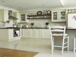 Choose dark charcoal gray for a bold yet still neutral cabinet paint color. White Kitchen With Cream Floor Tiles Novocom Top
