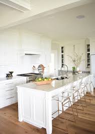 One simple color swap makes these the white walls reflect the sunlight, making the space feel larger and more welcoming. Nantucket Inspired White Kitchen Design Home Bunch Interior Design Ideas