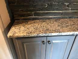 Furniture is natural/warm tones and some dark wood. Santa Cecilia Light Granite Jasper Ga Granite Countertop Warehouse