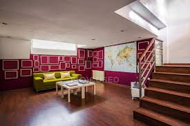 Check spelling or type a new query. Contemporary Spacious Living Room With Wooden Floor And Staircase Furnished With Bright Green Sofa And Decorated With Geometric Elements On Red Walls Hall Couch Stock Photo 445598460