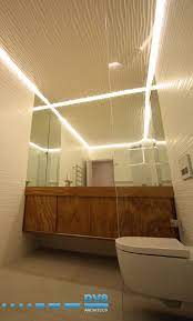 Flow Bathroom With 3d Routed Valchromat Ceiling Expressing Movement Timber Vanity With Recessed Lighting Along Peri Timber Vanity Recessed Lighting Valchromat