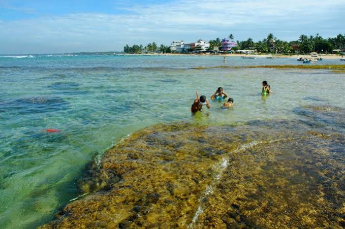 Hikkaduwa coral reef snorkelling beach surf town Sri Lanka coastal ride