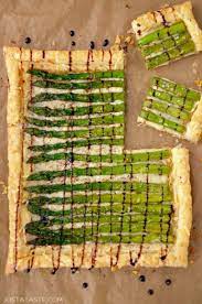 Cheesy Asparagus Tart Drizzled With Balsamic Syrup On Brown Paper Asparagus Tart Asparagus Asparagus Tart Recipes