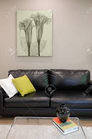 Of which the latter were called 'quartetto tables'. Family Room Design Furnished With Black Leather Sofa And Glass Coffee Table Atop White Fluffy Rug Northwest Usa Stock Photo Picture And Royalty Free Image Image 89827607