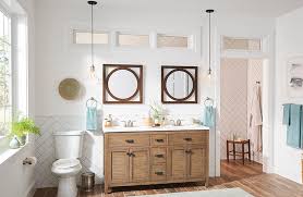Gold hardware and light fixtures add contemporary glamour to this streamlined white vanity. How To Choose Bathroom Vanity Lighting Riverbend Home