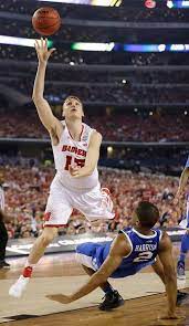Description Of Wisconsin Forward Sam Dekker 15 Shoots Over Kentucky Guard Aaron Ha College Basketball Teams Wisconsin Basketball College Basketball Players