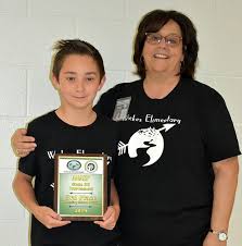 McKenzie Achieves 3rd Highest Score in Archery Tournament