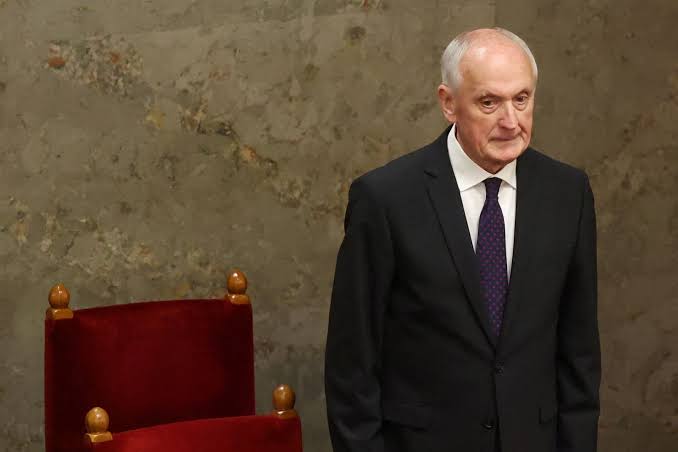 András Baka stands before the Hungarian Parliament following his election as President.