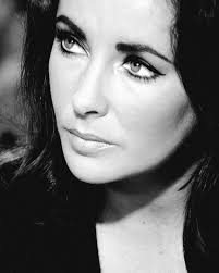 Beautiful, Elizabeth Taylor goes wild at the Ingemar Johansson/Floyd  Patterson fight way way back on, June 20, 1960. Patterson won in a fifth  round knockout. Love these photos of her. 👍🏿❤️