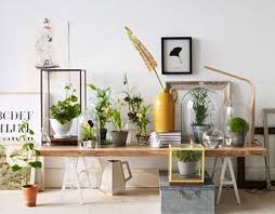 Console Table Platform In Front Of Picture Window Plants In Display Cases And Cloches Pretty Stylish Green Interior Inspiration Interior Casual Dining Rooms