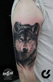 Black And Grey Wolf Tattoo Black And Grey Wolf Tattoo On The Right Upper Arm In In 2020 Grey Wolf Tattoo Wolf Tattoos Wolf Tattoo