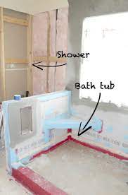 An oversized map pops against the emerald wall, while new tiles and fixtures pull the look together. Master Bathroom Remodel Without Tub Guest Bathroom Design Zen Bathroom Design Master Bathroom Without Tub