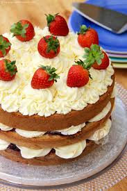 Homemade delicious strawberry sponge cake decorated with fresh strawberries on white kitchen table background. Victoria Sponge Celebration Cake Jane S Patisserie