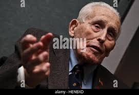 FORT MEADE, Md., -- Spc. Joshua R. Watson, an analyst assigned to A.  Company, 742nd Military Intelligence Battalion, who is also a former  MacArthur Middle School student, helps an 8th grader with