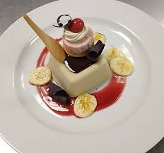 New Age Banana Split Banana Mousse With Walnut Crunch Chocolate Sauce And Curls Strawberry Souffle Glace And M Banana Mousse Just Cakes Strawberry Souffle
