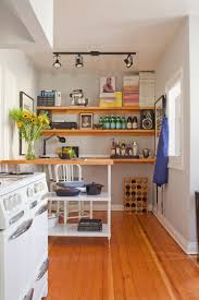6 Ways To Make A Small Kitchen Look Infinitely Bigger Kitchen Island Storage Rental Kitchen Small Kitchen