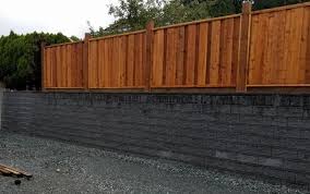 Concrete blocks are ideal for building walls to hold back the soil after you dig into a slope for a pathway, patio, or another landscaping project. How Much Does A Allan Block Concrete Retaining Wall Cost Back40 Hardscape Landscaping