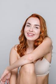 Portrait Of Smiling Redhead Woman In Underwear by Stocksy Contributor  Aleksandra Jankovic - Stocksy