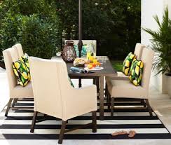 Black And White Outdoor Furniture Set A Patio Dining Set With A Black And White Umbrella Patio Dining Furniture Outdoor Furniture Sets Patio Furniture Covers