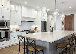 The contrast between more rustic finishes (typically seen with farmhouse style), and the warm gleaming reflection of brass, is a beautiful sight to see. Modern Ranch Kitchen For A Farmhouse Hipster Tanna By Design