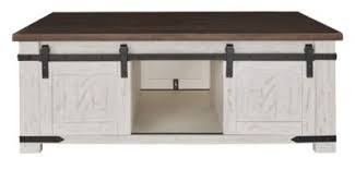 Coffee table with sliding doors. Ashley Wystfield Coffee Table With Sliding Doors Homemakers Furniture