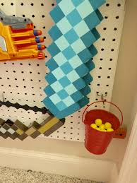 Check out this easy diy pegboard nerf gun rack! Make Your Own Easy Diy Nerf Gun Wall