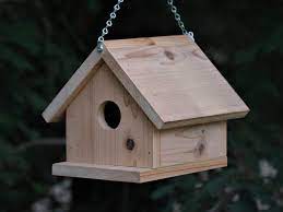 The hole should be placed 2 inches (5.1 cm) from the top of the wood and 2.5 inches (6.4 cm) from both sides. Birdhouse Hanging Style Made From Cedar Wood Etsy Wooden Bird Houses Bird House Bird Houses Diy