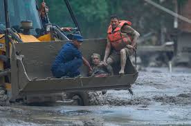 At least 75 killed and hundreds missing after flash floods in Nepal and China