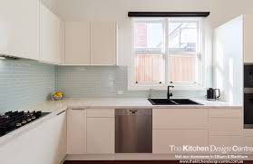 A Sleek And Simple Kitchen And Laundry For This Beautiful Home In Kew No Handles White Cabinets Integrated Fridges Simple Kitchen Integrated Fridge Kitchen