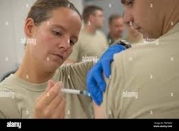 Capt. Joli Beasley, 130th Airlift Wing clinical nurse, prepares a vaccine  for injection in the medical clinic at McLaughlin Air National Guard Base,  Charleston, W.Va., June 22, 2017. Airmen receive vaccinations and  immunizations at the clinic to guard against ...