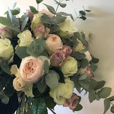 It features red and yellow germini, carnations, iris, pistachio foliage and more. Handtied Bouquets Holly Ivy Flowers